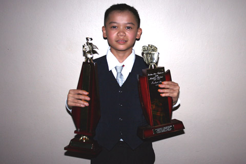 Kelvin Luu with his trophies.