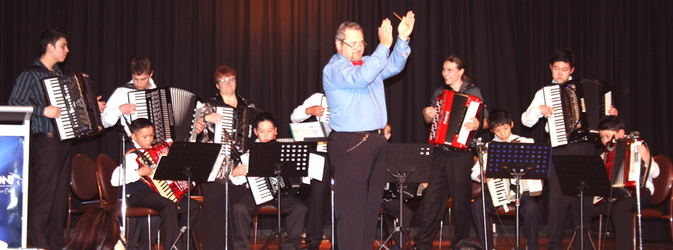 "The Accordigles" was then joined by the "Funkordion" Accordion Ensemble. Here, conductor Steve Marx is leading the audience clapping.