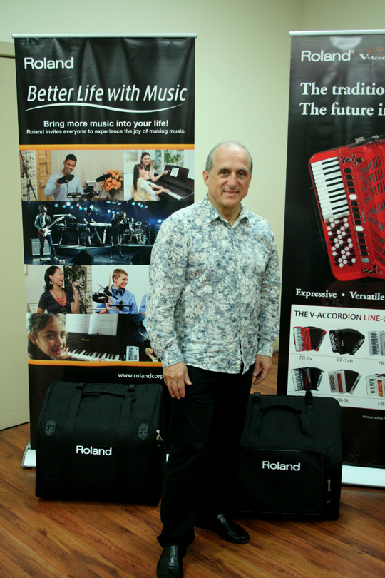 Ross Maio with two of the Roland banners.