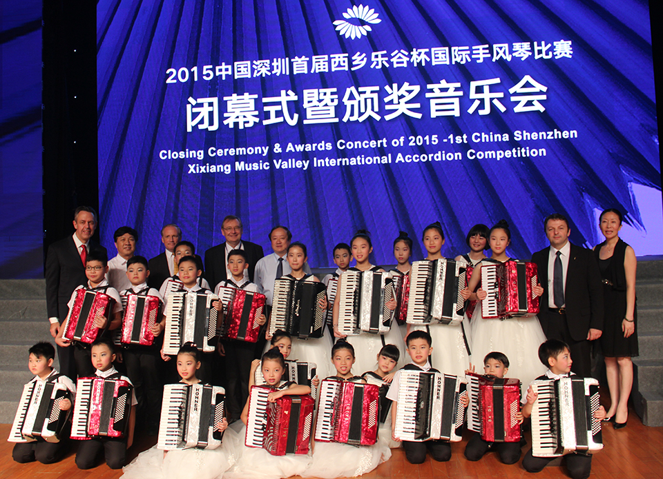 CIA Officials Kevin Friedrich, Raymond Bodell, Harley Jones, Li Cong and MIrco Patarini with the young accordionists