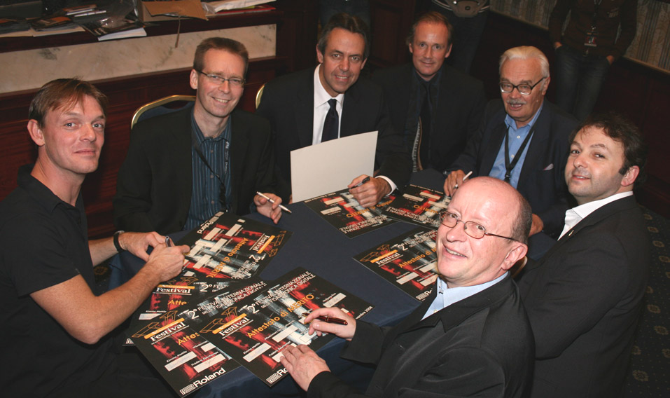 Jury Members signing the certificates for the contestants, left circling to right: Frederic Deschamps (France), Kimmo Mattila (Finland), Kevin Friedrich (USA), Raymond Bodell (UK), Lech Puchnowski (Poland), Wolfgang Russ (Germany).