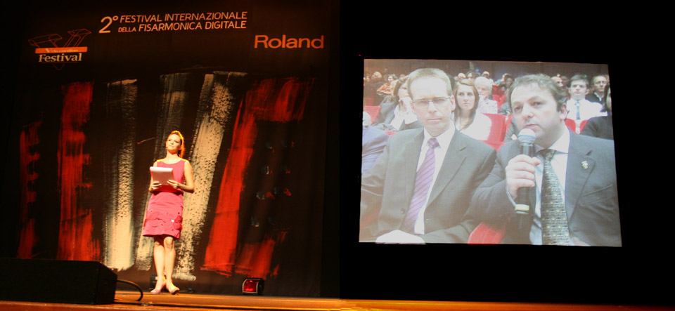Left is Presenter Alessandra Bellini and on the large screen is pictured Chairman of the Jury Kimmo Mattila (Finland), his comments about the competition being translated into Italian language for the audience by jury member Mirco Patarini (Italy).